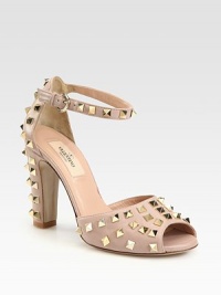 An adjustable ankle strap tops this classic leather silhouette, coated with metal studs for a hint of rocker-edge. Self-covered heel with studs, 3¾ (95mm)Leather upperLeather lining and solePadded insoleMade in ItalyOUR FIT MODEL RECOMMENDS ordering one half size up as this style runs small. An adjustable ankle strap tops this classic leather silhouette, coated with metal studs for a hint of rocker-edge. Self-covered heel with studs, 3¾ (95mm)Leather upperLeather lining and solePadded insoleMade in ItalyOUR FIT MODEL RECOMMENDS ordering one half size up as this style runs small.