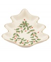 Sweet tree. Pretty for serving peppermints and other holiday sweets, this porcelain candy dish from Lenox's collection of serveware and serving dishes is trimmed with gold and a holly motif to match the beloved Lenox Holiday dinnerware collection.