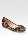 Leopard-print calf hair flat has contrasting leather trim that concludes with a dainty, metal-tip bow at the toe. Leopard-print calf hair and leather upperLeather lining and solePadded insoleImported