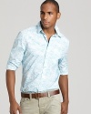 With its light floral print, this slim-fitting sport shirt adds casual refinement to your relaxed wardrobe.