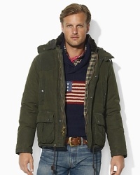 Embrace your rugged side with an essential hunter-inspired jacket, lined with a plaid pattern and accented by a gunpatch at the shoulder for an authentic feel. Embrace your rugged side with an essential hunter-inspired jacket, lined with a plaid pattern and accented by a gunpatch at the shoulder for an authentic feel.