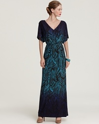 Infused with a ravishing print, this Trina Turk maxi dress in billowing silk is ideal for effortless day-to-night wear. Infused with a ravishing print, this Trina Turk maxi dress in billowing silk is ideal for effortless day-to-night wear.
