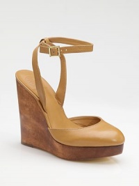 A richly stained wood wedge and platform sit underneath a leather sandal with a shapely closed toe and slender ankle strap.Wood wedge, 5½ (140mm) Wood platform, 1 (25mm) Compares to a 4½ heel (115mm) Buckle ankle strap Leather lining and sole Padded insole ImportedOUR FIT MODEL RECOMMENDS ordering one half size up as this style runs small. A richly stained wood wedge and platform sit underneath a leather sandal with a shapely closed toe and slender ankle strap.Wood wedge, 5½ (140mm) Wood platform, 1 (25mm) Compares to a 4½ heel (115mm) Buckle ankle strap Leather lining and sole Padded insole ImportedOUR FIT MODEL RECOMMENDS ordering one half size up as this style runs small.
