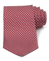 This handsome silk tie from Salvatore Ferragamo, cut in a classic silhouette for traditional appeal, helps you transition from the office into your evening affairs. This handsome silk tie from Salvatore Ferragamo, cut in a classic silhouette for traditional appeal, helps you transition from the office into your evening affairs.