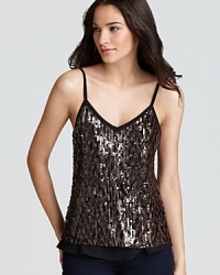 Top off your skinny jeans with this party-perfect top by GUESS, embellished with sequins and touches of sheer perfection. Top off your skinny jeans with this party-perfect top by GUESS, embellished with sequins and touches of sheer perfection.