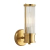 The elongated design and warm natural brass of this Ralph Lauren sconce lends luxurious light to any space.