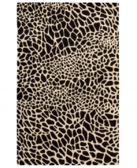 Survival of the prettiest. An exotic print adorns Nourison's Skyland rug in bold, contrasting black and ivory hues, bringing a wildly chic look to any space. The plush wool rug is enhanced with meticulous hand carving for beautiful detail and texture. (Clearance) Survival of the prettiest. An exotic print adorns Nourison's Skyland rug in bold, contrasting black and ivory hues, bringing a wildly chic look to any space. The plush wool rug is enhanced with meticulous hand carving for beautiful detail and texture. (Clearance)