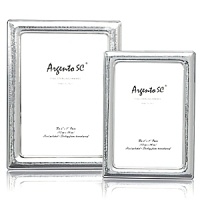 Argento hammered sterling silver frame. Dual easel for portrait and landscape tabletop display. Solid .925 fine sterling silver. Clear lacquered for tarnish free appearance. Argento hammered sterling silver frame. Dual easel for portrait and landscape tabletop display. Solid .925 fine sterling silver. Clear lacquered for tarnish free appearance.