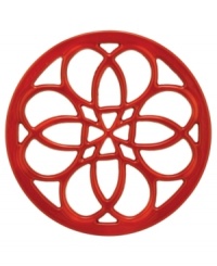 This quaint cast iron trivet, a charming piece to place on any countertop or dining table, features a classic pattern that protects virtually any surface from hot pots and pans. Limited lifetime warranty. (Clearance) This quaint cast iron trivet, a charming piece to place on any countertop or dining table, features a classic pattern that protects virtually any surface from hot pots and pans. Limited lifetime warranty. (Clearance)