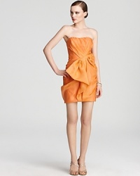 Origami-like ruffles elevate this vibrantly hued ABS by Allen Schwartz strapless dress to an art form. Origami-like ruffles elevate this vibrantly hued ABS by Allen Schwartz strapless dress to an art form.