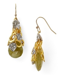 Alexis Bittar interprets the floral motif in dramatic fashion with this pair of garnet stone earrings, accented by a delicate cascade of plated metals and Swarovski crystals. Alexis Bittar interprets the floral motif in dramatic fashion with this pair of garnet stone earrings, accented by a delicate cascade of plated metals and Swarovski crystals.
