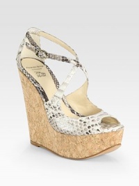 Strappy, adjustable python straps with a natural cork wedge and ultra-high platform. Cork wedge, 5½ (140mm)Island platform,1½ (40mm)Compares to a 4 heel (100mm)Python upperLeather liningBuffed leather solePadded insolePattern may varyImportedOUR FIT MODEL RECOMMENDS ordering true size. Strappy, adjustable python straps with a natural cork wedge and ultra-high platform. Cork wedge, 5½ (140mm)Island platform,1½ (40mm)Compares to a 4 heel (100mm)Python upperLeather liningBuffed leather solePadded insolePattern may varyImportedOUR FIT MODEL RECOMMENDS ordering true size.