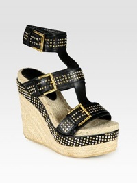 Adjustable, wide leather straps covered in silvertone and goldtone studs, elevated by a traditional espadrille wedge. Hemp and leather wedge, 5 (125mm)Hemp and leather platform, 2 (50mm)Compares to a 3 heel (75mm)Studded leather upperLeather liningRubber soleMade in SpainOUR FIT MODEL RECOMMENDS ordering true whole size; ½ sizes should order the next whole size up. Adjustable, wide leather straps covered in silvertone and goldtone studs, elevated by a traditional espadrille wedge. Hemp and leather wedge, 5 (125mm)Hemp and leather platform, 2 (50mm)Compares to a 3 heel (75mm)Studded leather upperLeather liningRubber soleMade in SpainOUR FIT MODEL RECOMMENDS ordering true whole size; ½ sizes should order the next whole size up.