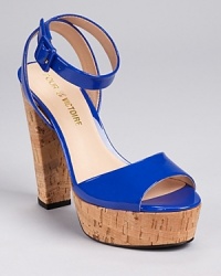Lustrous patent leather looks fresh against natural cork on Pour La Victoire's Nasha sandals, while a chunky heel adds a lighthearted feel. Lustrous patent leather looks fresh against natural cork on Pour La Victoire's Nasha sandals, while a chunky heel adds a lighthearted feel.