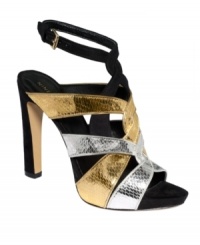 Reach for platinum status in these sexy pumps. Nine West's Hitmaker platform sandals feature crisscrossing metallic straps that create a trendy caged look.