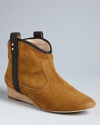 Amble along in these Western-influenced Matt Bernson booties, that stand apart from the pack with contrast tab sides highlighted by post hardware. Amble along in these Western-influenced Matt Bernson booties, that stand apart from the pack with contrast tab sides highlighted by post hardware.