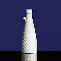Simple shapes of crisp white are accented with precisely etched lines. Contrasting black matte jasper accessories with glazed interiors are also available. Bone china. Simple shapes of crisp white are accented with precisely etched lines. Contrasting black matte jasper accessories with glazed interiors are also available. Bone china.