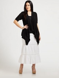 Layer this lightweight, open-front piece over your favorite tank or camisole. You will adore how the feminine, cascade hem complements your shape. Open-front designElbow-length sleevesRibbed trimCascade hemAbout 27 from shoulder to hemCottonHand washImported Layer this lightweight, open-front piece over your favorite tank or camisole. You will adore how the feminine, cascade hem complements your shape. Open-front designElbow-length sleevesRibbed trimCascade hemAbout 27 from shoulder to hemCottonHand washImported