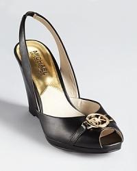Low-cut sides lend a feminine touch to MICHAEL Michael Kors' Rochelle slingbacks, adorned with an iconic MK logo detail at a peep toe. Low-cut sides lend a feminine touch to MICHAEL Michael Kors' Rochelle slingbacks, adorned with an iconic MK logo detail at a peep toe.