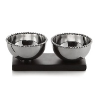 Marked by the incredible handcrafting that the Molten motif is known for, this double snack bowl set is embellished with countless molten beads carefully placed by a highly skilled artisan. It's paired with an acacia wood base for a look that's streamlined, timeless, organic and soulful. Marked by the incredible handcrafting that the Molten motif is known for, this double snack bowl set is embellished with countless molten beads carefully placed by a highly skilled artisan. It's paired with an acacia wood base for a look that's streamlined, timeless, organic and soulful.