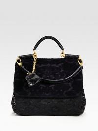 A beautiful blend of velvet, sequins, cotton lace and snakeskin in a roomy carryall design.Snakeskin top handle, 5½ dropDetachable snakeskin shoulder strap, 9 dropMagnetic snap flap closureMagnetic snap gussetsDetachable snakeskin coin pouchOne inside zip pocketTwo inside open pocketsCotton lining13W X 11½H X 6DMade in Italy