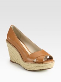Criss-cross leather straps accompany a hemp, espadrille-inspired wedge. Hemp-covered wedge, 4 (100mm)Covered platform, 1½ (40mm)Compares to a 2½ heel (65mm)Leather upperLeather liningBuffed leather and rubber solePadded insoleImported Criss-cross leather straps accompany a hemp, espadrille-inspired wedge. Hemp-covered wedge, 4 (100mm)Covered platform, 1½ (40mm)Compares to a 2½ heel (65mm)Leather upperLeather liningBuffed leather and rubber solePadded insoleImported