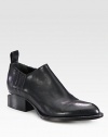 An oxford-inspired leather silhouette with elastic side gores and modern cut-out stacked heel. Stacked heel, 1¼ (30mm)Leather upper with elastic goresLeather pull-tabLeather lining and solePadded insoleImported