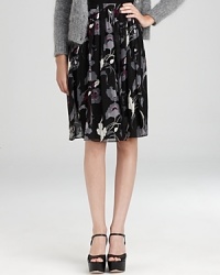 Imbue your everyday look with effortless romance in a DKNY skirt blooming with dark florals and dramatic pleats. Imbue your everyday look with effortless romance in a DKNY skirt blooming with dark florals and dramatic pleats.