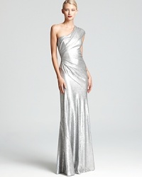 A one-shoulder gown from Donna Karan New York shines with illuminating sequins while elegant draping and ruching flatters your figure with every turn. A one-shoulder gown from Donna Karan New York shines with illuminating sequins while elegant draping and ruching flatters your figure with every turn.