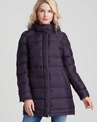 Fight the freeze in this lush down jacket by The North Face®, featuring an attached hood and a longer silhouette for exceptional protection. Fight the freeze in this lush down jacket by The North Face®, featuring an attached hood and a longer silhouette for exceptional protection.
