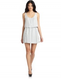 THE LOOKScoop necklineRhinestone embellishments at front and bottom trimSleevelessLonger silk underlayerScoop back with zip closureTHE FITAbout 32.5 from shoulder to hemTHE MATERIALSilkFully linedCARE & ORIGINDry cleanImported THE LOOKScoop necklineRhinestone embellishments at front and bottom trimSleevelessLonger silk underlayerScoop back with zip closureTHE FITAbout 32.5 from shoulder to hemTHE MATERIALSilkFully linedCARE & ORIGINDry cleanImported