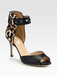 Signature metal studs decorate the ankle strap of this leather design, elevated by a sky-high heel. Self-covered heel, 3½ (90mm)Leather upper with metal studsAdjustable ankle strap and back zipLeather lining and solePadded insoleMade in Italy Signature metal studs decorate the ankle strap of this leather design, elevated by a sky-high heel. Self-covered heel, 3½ (90mm)Leather upper with metal studsAdjustable ankle strap and back zipLeather lining and solePadded insoleMade in Italy