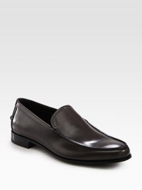 A finely crafted, moccasin-style slip-on is distinguished by debossed logo detail and stacked leather heel. Leather liningPadded insoleLeather soleMade in Italy A finely crafted, moccasin-style slip-on is distinguished by debossed logo detail and stacked leather heel. Leather liningPadded insoleLeather soleMade in Italy