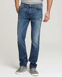 The Brixton is a skinny, straight leg fit with a narrow leg opening. Back pockets feature Joe's Jean's signature stitched arc and leather logo patch. The Brixton is a skinny, straight leg fit with a narrow leg opening. Back pockets feature Joe's Jean's signature stitched arc and leather logo patch.