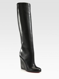 Luscious calfskin forms this fashionable knee-high design on a practical wedge. Covered wedge, 4½ (115mm)Shaft, 15Leg circumference, 16Leather upperLeather liningSignature red leather solePadded insoleMade in ItalyOUR FIT MODEL RECOMMENDS ordering one size up as this style runs small. Luscious calfskin forms this fashionable knee-high design on a practical wedge. Covered wedge, 4½ (115mm)Shaft, 15Leg circumference, 16Leather upperLeather liningSignature red leather solePadded insoleMade in ItalyOUR FIT MODEL RECOMMENDS ordering one size up as this style runs small.