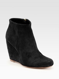 Impeccably soft suede design, heightened by a covered wedge and topped with a side zipper. Self-covered wedge, 4 (100mm)Suede upperSide zipLeather lining and solePadded insoleImported Impeccably soft suede design, heightened by a covered wedge and topped with a side zipper. Self-covered wedge, 4 (100mm)Suede upperSide zipLeather lining and solePadded insoleImported