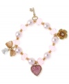 Beautiful in pink. This multi-charm half stretch bracelet from Betsey Johnson is crafted from antique gold-tone mixed metal with glittering accents and glistening glass beads. Item comes packaged in a signature Betsey Johnson Gift Box. Approximate length: 7-1/2 inches.