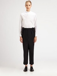 In a signature Junya Watanabe move, the designer turns a classic menswear-inspired shirt on its head by tailoring it to be worn with the buttons down the back.High stand collar with back pointsLong sleeves with button cuffsBack button placketBack patch pocketAbout 26 from shoulder to hemCottonDry cleanImportedModel shown is 5'9½ (176cm) wearing US size Small. In a signature Junya Watanabe move, the designer turns a classic menswear-inspired shirt on its head by tailoring it to be worn with the buttons down the back.High stand collar with back pointsLong sleeves with button cuffsBack button placketBack patch pocketAbout 26 from shoulder to hemCottonDry cleanImportedModel shown is 5'9½ (176cm) wearing US size Small.
