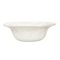 This Vietri bowl was crafted by hand in Tuscany of durable, textural terra cotta for an irresistibly warm appeal. Ornament rolls are used to create its ornate designs.