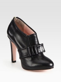Supple leather ankle boot has an exposed back zipper and a simply divine bow. Self-covered heel, 4 (100mm)Leather upperBack zipperLeather lining and solePadded insoleMade in Italy Supple leather ankle boot has an exposed back zipper and a simply divine bow. Self-covered heel, 4 (100mm)Leather upperBack zipperLeather lining and solePadded insoleMade in Italy