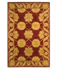 A golden vine-and-floral motif creates exquisite contrast against a deep maroon ground, adding fine finesse to this plush area rug from Safavieh. Tufted in India from pure wool, this rug evokes classic Persian designs in a bold, bright color palette for the contemporary home. (Clearance) A golden vine-and-floral motif creates exquisite contrast against a deep maroon ground, adding fine finesse to this plush area rug from Safavieh. Tufted in India from pure wool, this rug evokes classic Persian designs in a bold, bright color palette for the contemporary home. (Clearance)
