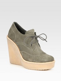 Classically perforated suede oxford revived by a soaring rubber wedge and platform. Rubber wedge, 5 (125mm)Rubber platform, 1 (25mm)Compares to a 4 heel (100mm)Suede upperLeather liningRubber solePadded insoleMade in Italy Classically perforated suede oxford revived by a soaring rubber wedge and platform. Rubber wedge, 5 (125mm)Rubber platform, 1 (25mm)Compares to a 4 heel (100mm)Suede upperLeather liningRubber solePadded insoleMade in Italy