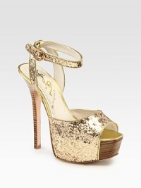 Uplifted by a stacked heel and partially covered platform, this glitzy metallic leather go-to has an adjustable ankle strap and a peep toe. Stacked heel, 5½ (140mm)Covered platform, 2 (50mm)Compares to a 3½ heel (90mm)Metallic leather and glitter-coated leather upperLeather lining and solePadded insoleImportedOUR FIT MODEL RECOMMENDS ordering one half size up as this style runs small. Uplifted by a stacked heel and partially covered platform, this glitzy metallic leather go-to has an adjustable ankle strap and a peep toe. Stacked heel, 5½ (140mm)Covered platform, 2 (50mm)Compares to a 3½ heel (90mm)Metallic leather and glitter-coated leather upperLeather lining and solePadded insoleImportedOUR FIT MODEL RECOMMENDS ordering one half size up as this style runs small.