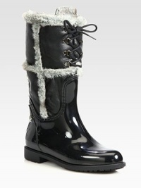 Rubber and leather rain boots are designed for warmth and protection from the elements.Shaft, 11¾Leg circumference, 15Rubber upperTextured nappa leather shaftLace-up frontFaux fur liningPadded insoleRubber tread soleMade in Spain Rubber and leather rain boots are designed for warmth and protection from the elements.Shaft, 11¾Leg circumference, 15Rubber upperTextured nappa leather shaftLace-up frontFaux fur liningPadded insoleRubber tread soleMade in Spain