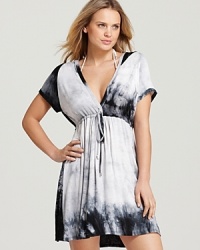In a desaturated tie dye print, Magicsuit's cozy coverup lends a cool look to poolside afternoons. In a desaturated tie dye print, Magicsuit's cozy coverup lends a cool look to poolside afternoons.