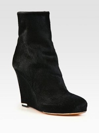 Instantly luxe calf hair design with leather trim and a hidden platform wedge. Self-covered wedge, 4½ (115mm)Hidden platform, 1 (25mm)Compares to a 3½ heel (90mm)Calf hair upper with leather trimSide zipLeather lining and solePadded insoleMade in ItalyOUR FIT MODEL RECOMMENDS ordering one size up as this style runs small. Instantly luxe calf hair design with leather trim and a hidden platform wedge. Self-covered wedge, 4½ (115mm)Hidden platform, 1 (25mm)Compares to a 3½ heel (90mm)Calf hair upper with leather trimSide zipLeather lining and solePadded insoleMade in ItalyOUR FIT MODEL RECOMMENDS ordering one size up as this style runs small.