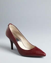 Lizard-look uppers and chic pointed toes set on moderate heels all spell sophisticated lady in these MICHAEL Michael Kors pumps. Lizard-look uppers and chic pointed toes set on moderate heels all spell sophisticated lady in these MICHAEL Michael Kors pumps.