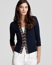Bold pebbled beading adds a touch of glamour to this Tory Burch cardigan. Showcase the deep navy hue against sleek white skinnies. Bold pebbled beading adds a touch of glamour to this Tory Burch cardigan. Showcase the deep navy hue against sleek white skinnies.
