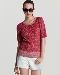 A peppy MARC BY MARC JACOBS short-sleeve sweater elevates classic white shorts, adding polish and charm to summer's latest uniform. A peppy MARC BY MARC JACOBS short-sleeve sweater elevates classic white shorts, adding polish and charm to summer's latest uniform.
