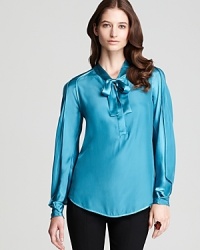 Feminine tailoring lends romantic inspiration to this Rachel Roy blouse, finished in a decadent jewel tone for effortless elegance. Feminine tailoring lends romantic inspiration to this Rachel Roy blouse, finished in a decadent jewel tone for effortless elegance.